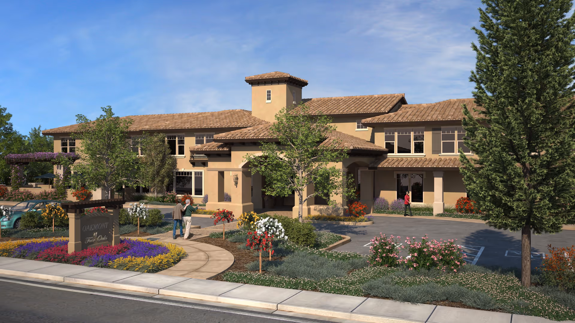Exterior front of Oakmont of Fair Oaks building with a landscaped driveway, entrance canopy, and people walking on the path.